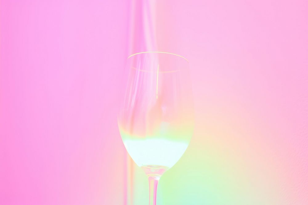 Pastel neon wine glass purple light illuminated.