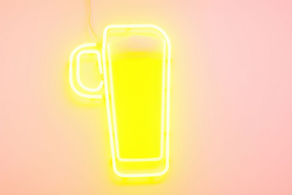 Pastel neon beer light yellow glass.