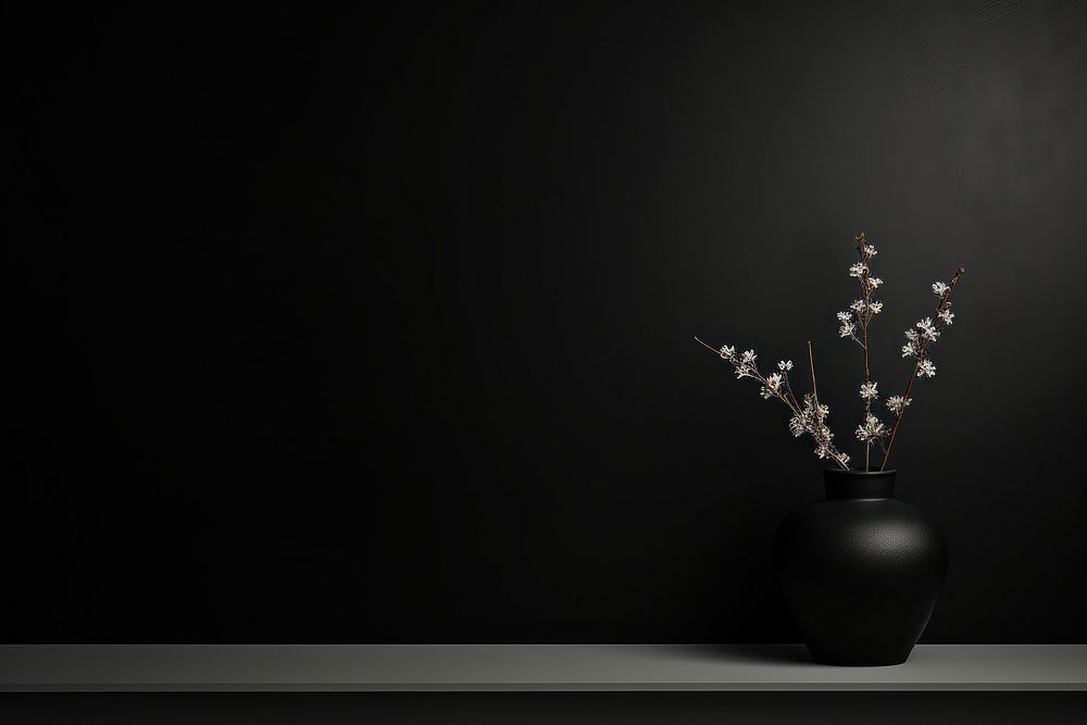Classic black flower plant vase.