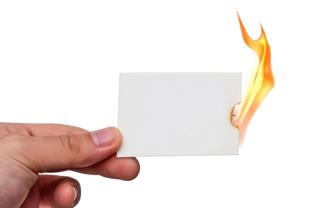Fingers hold namecard burning paper flame.