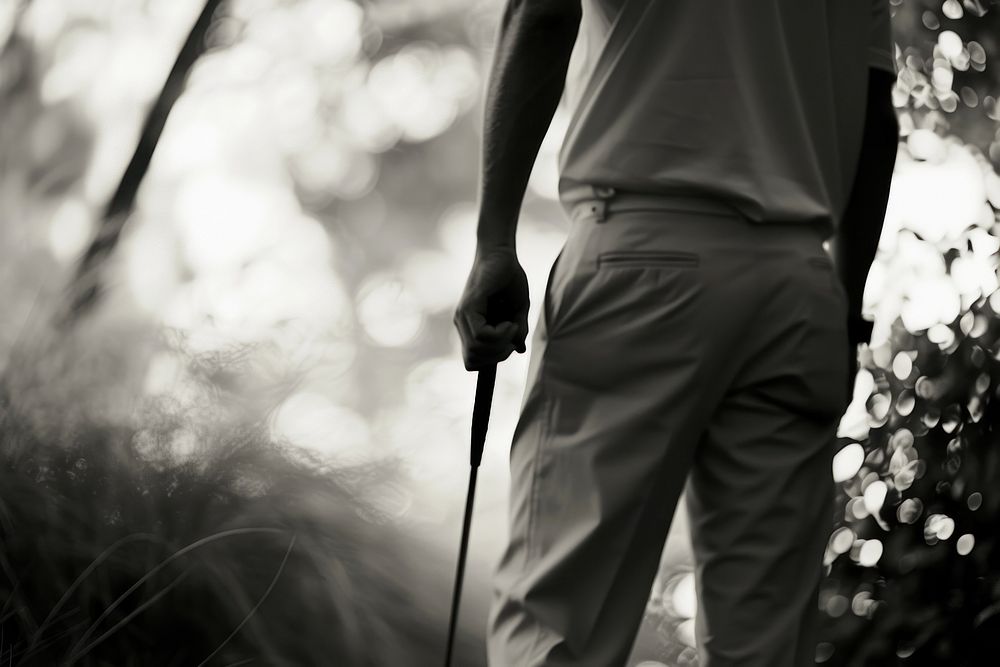 Golf holding walking adult.