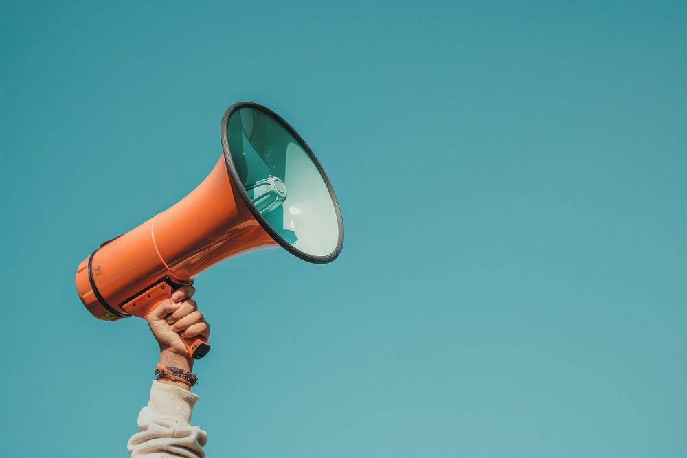 Megaphone holding person electronics.