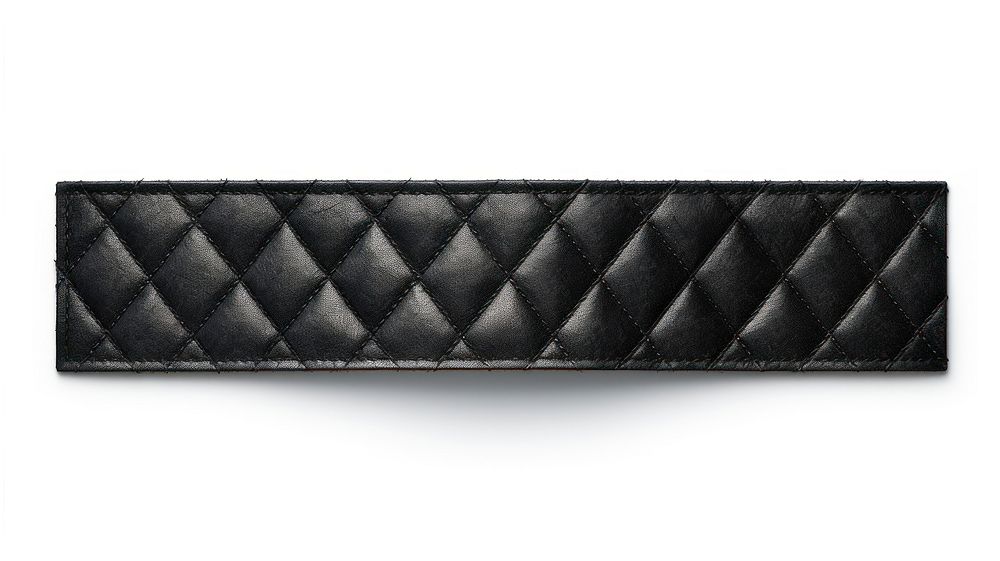 Argyle pattern adhesive strip black belt white background.