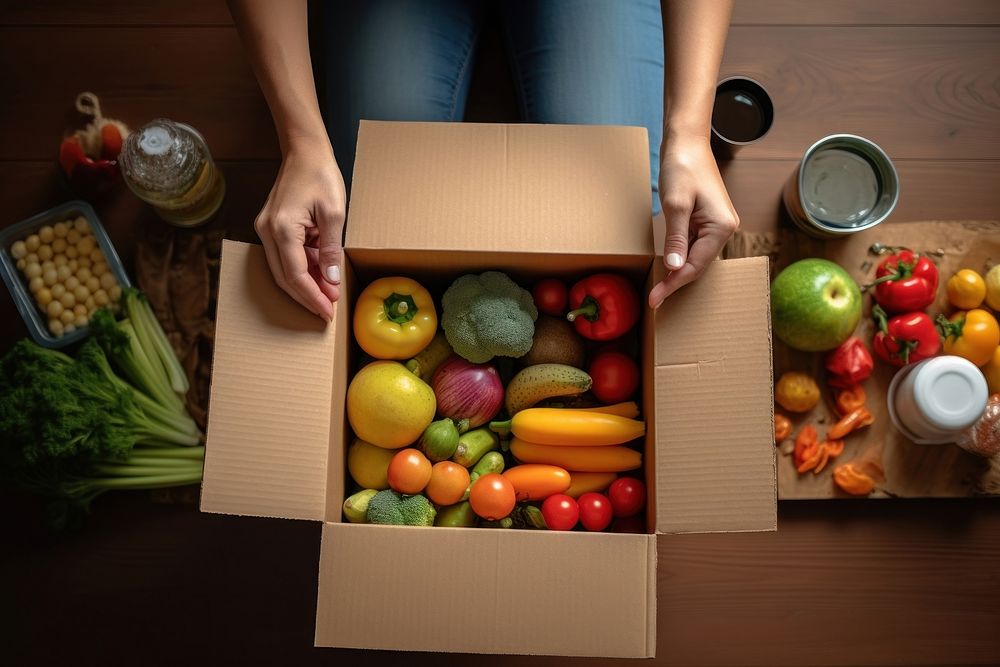 Volunteer box cardboard food fruit.