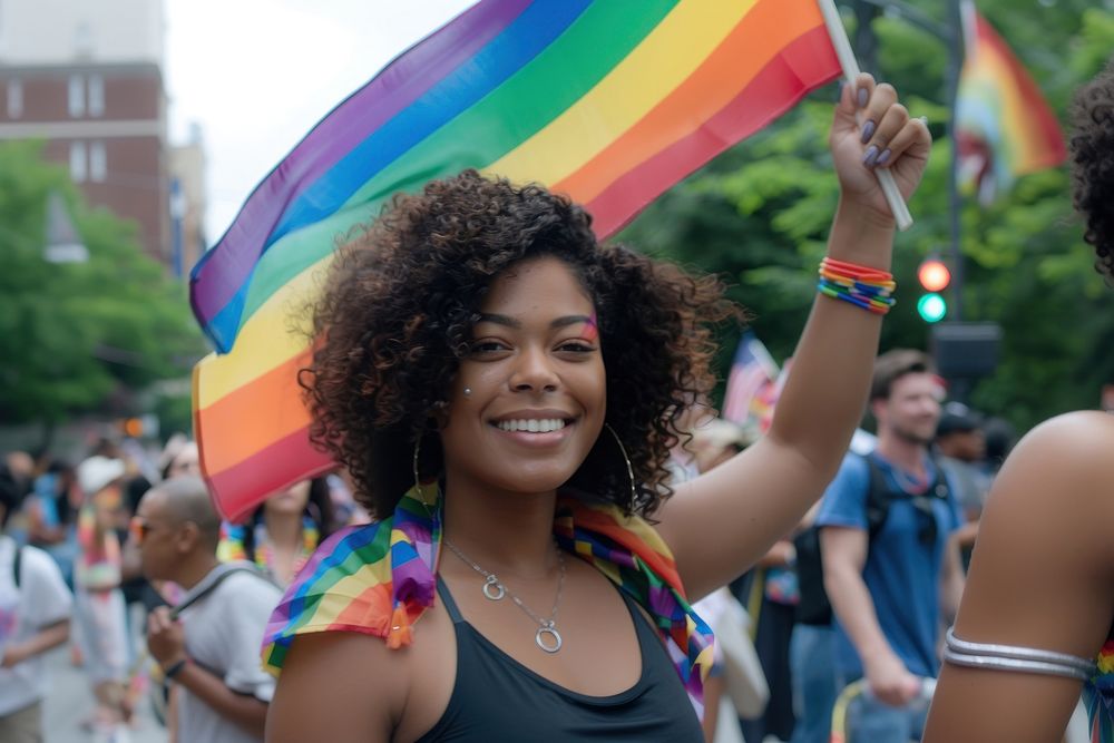 Photo of black woman rainbow parade street.