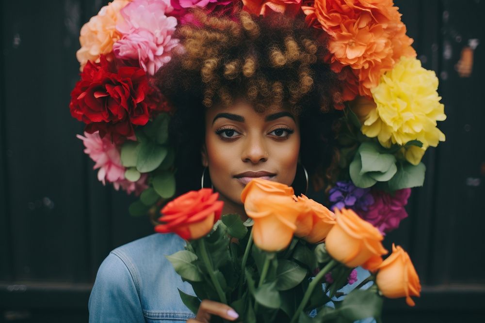 Blackwoman pride month fashion flower portrait holding.
