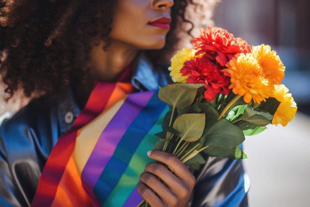 Blackwoman pride outfit fashion flower holding plant.