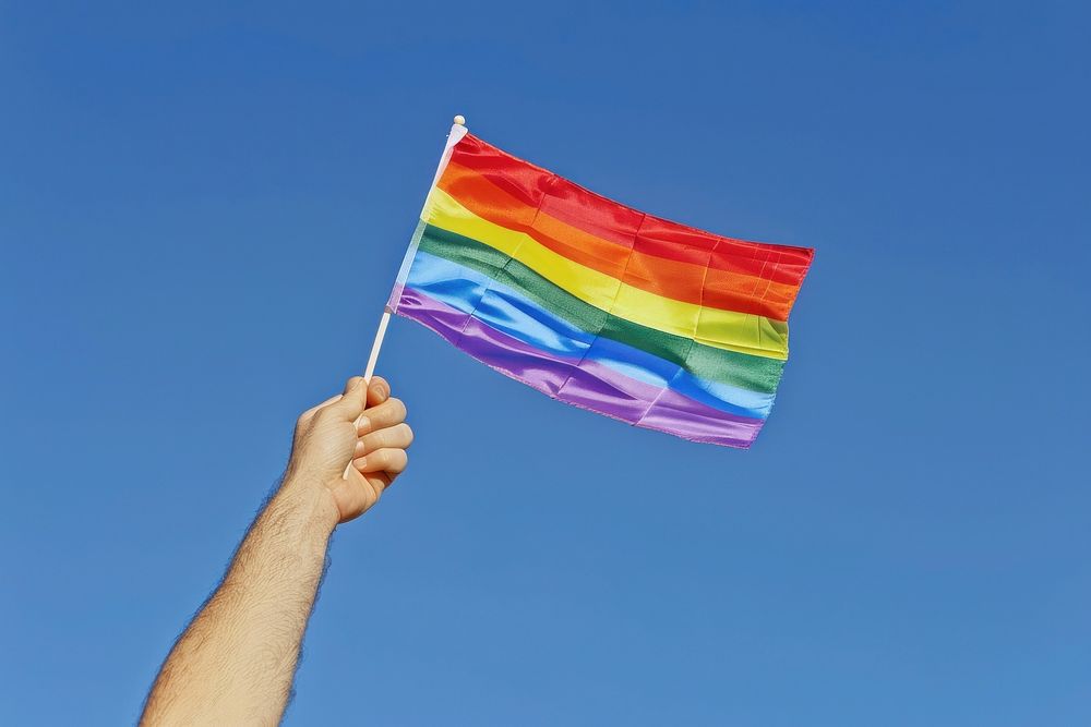 Photo of hand flag rainbow holding.