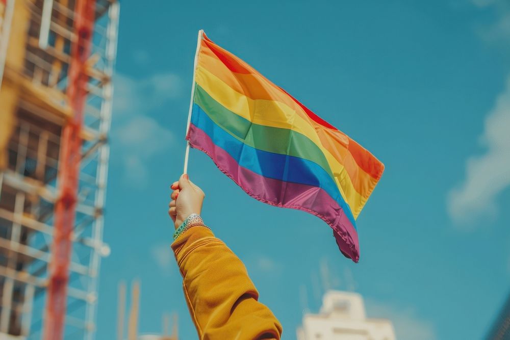 Photo of hand flag rainbow holding.