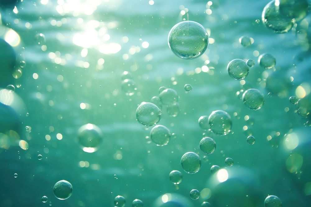 Bubbles and bokeh underwater green backgrounds outdoors.