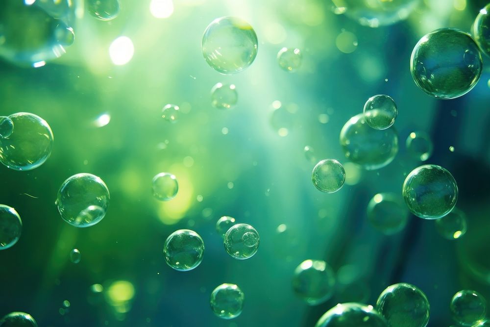 Bubbles and bokeh underwater green backgrounds sphere.
