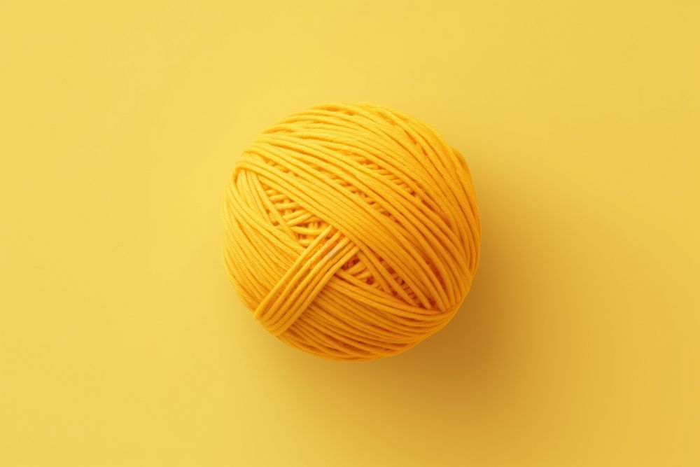 Yarn ball yellow creativity material.