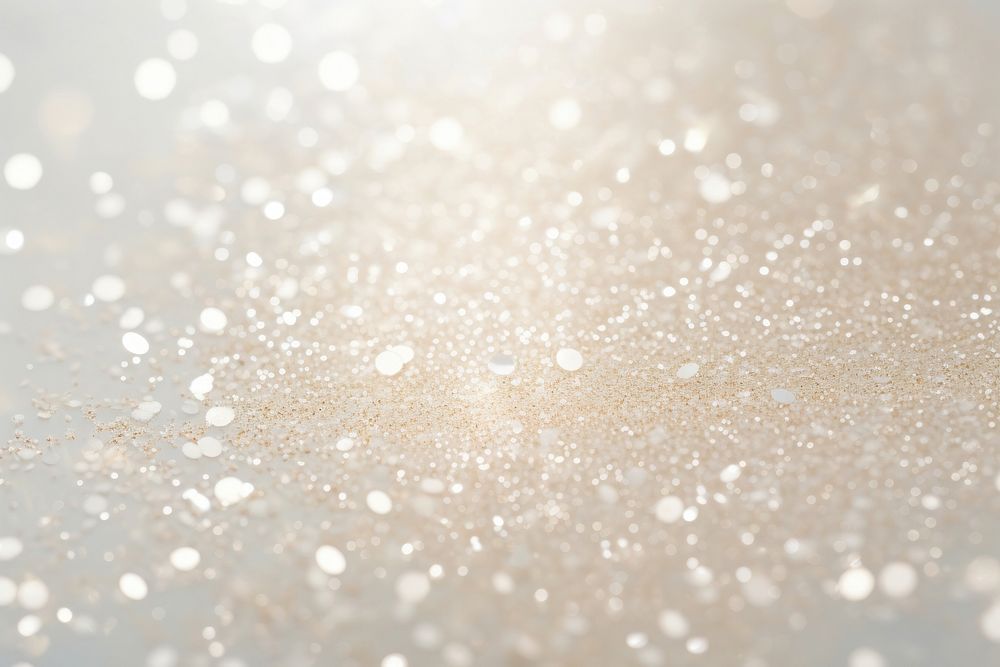 Pale glitter cream texture backgrounds defocused snowflake.