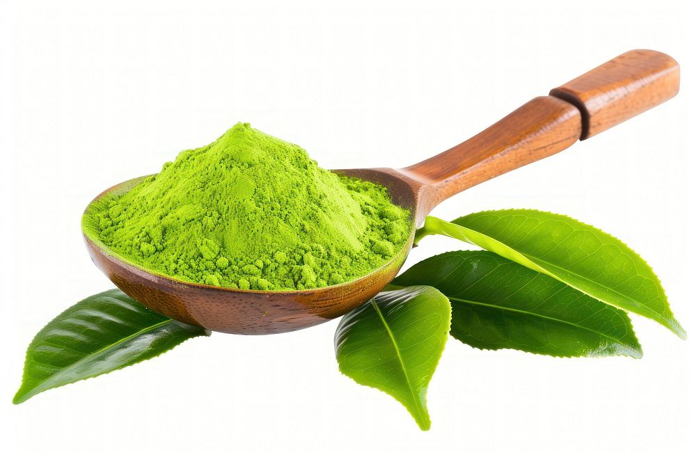 Green matcha powder in a wood spoon with tea leaves white background ingredient freshness.