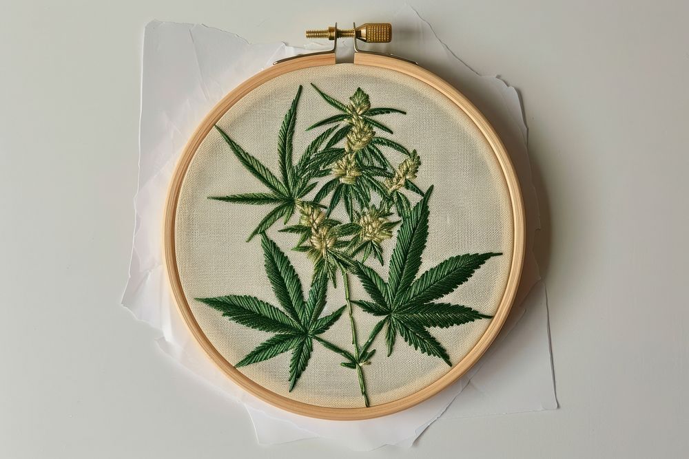 Cannabis in embroidery style pattern cross-stitch creativity.
