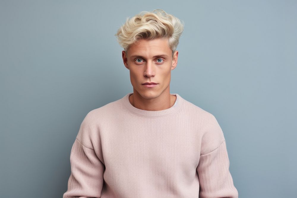 Man in a gray sweater portrait blonde photo.