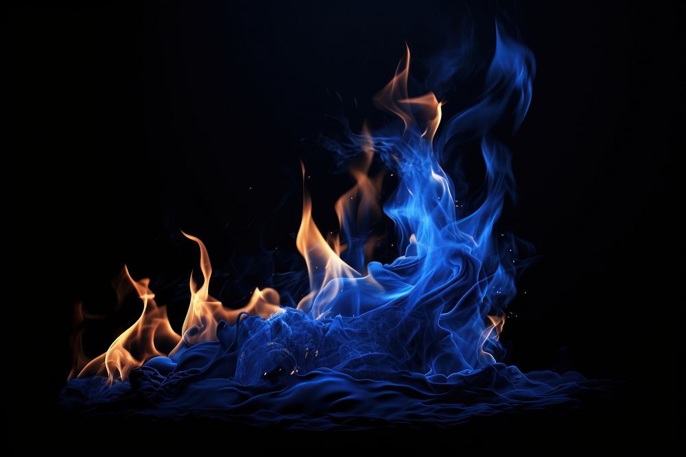 Blue mountain fire flame bonfire black background illuminated.