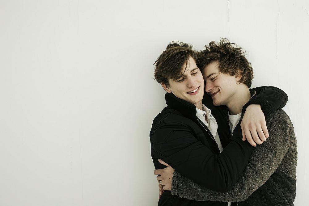 A gay couple portrait hugging adult.