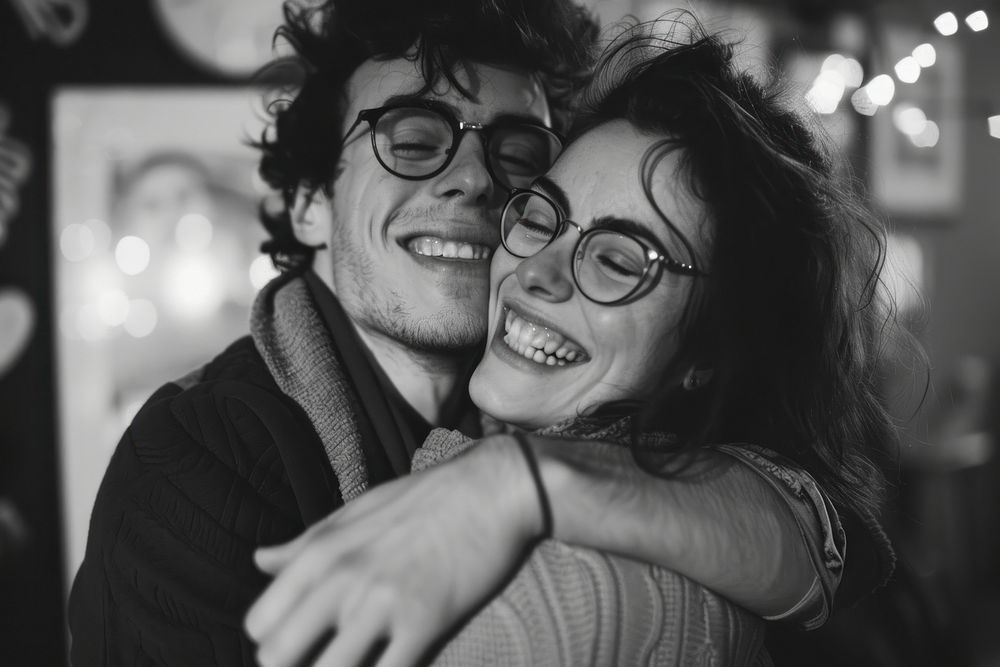 Guy couple hugging portrait smiling glasses.