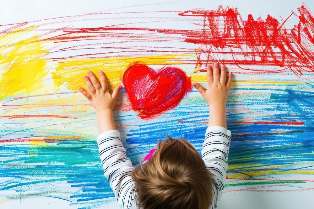 Child hands holding red heart drawing creativity paintbrush.