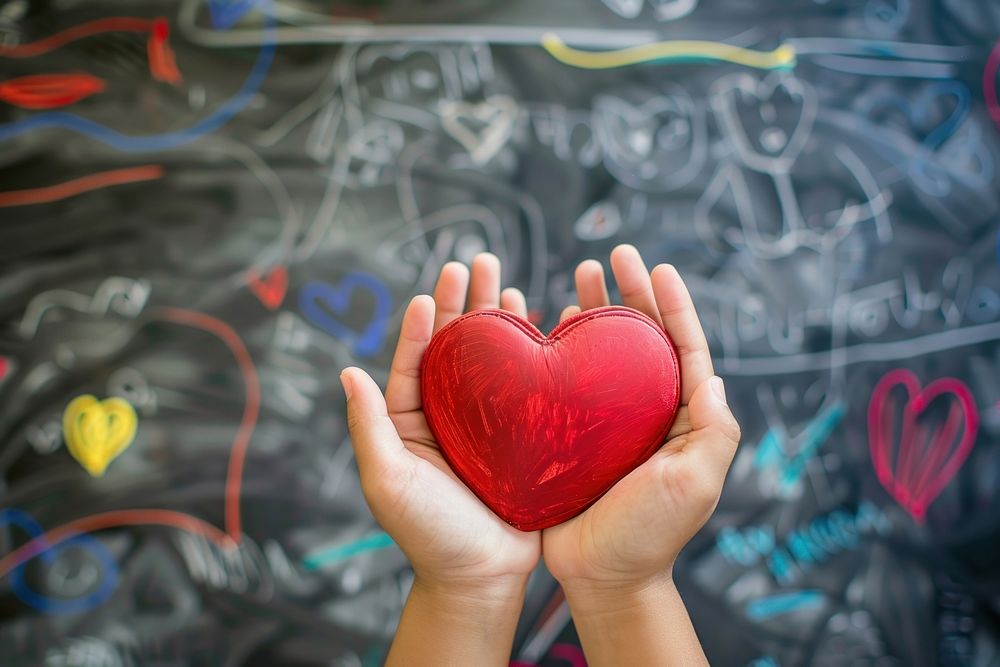 Child hands holding red heart creativity blackboard romance.