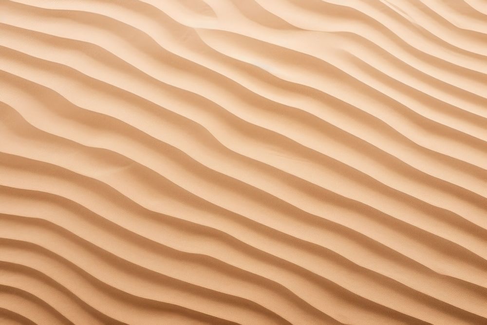 Wave pattern on sand backgrounds texture desert.