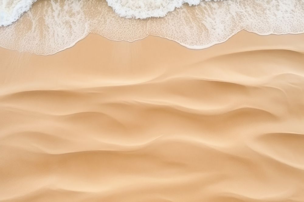 Waves on sand backgrounds outdoors nature.