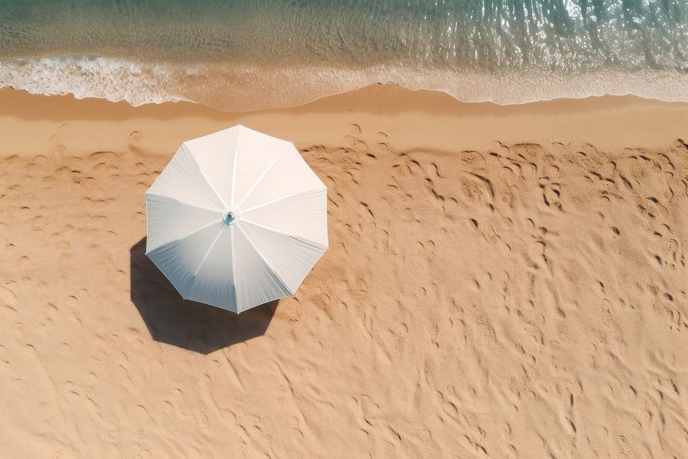 Beach umbrella on sand outdoors nature sea.