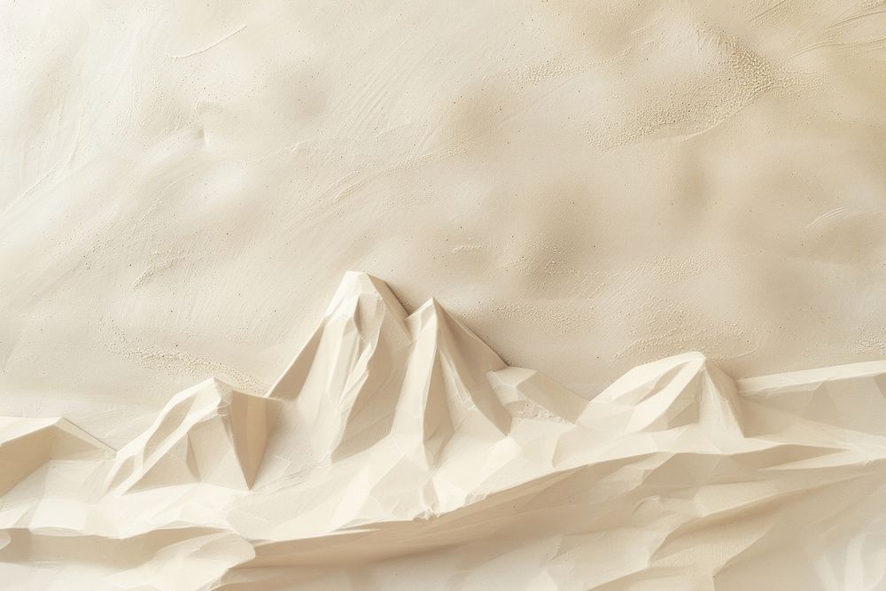 Mountain Sculpture on sand backgrounds paper white.