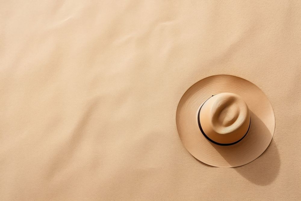 Hat on sand backgrounds nature copy space.