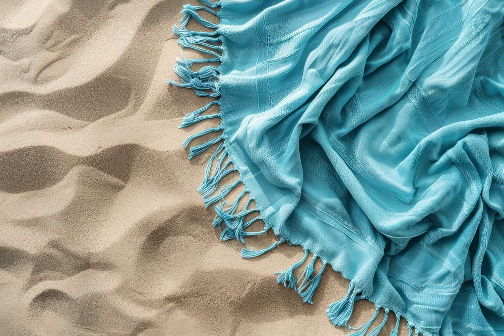 Beach towel on sand backgrounds outdoors nature.