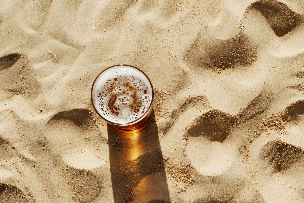 Beer on sand drink refreshment beverage.