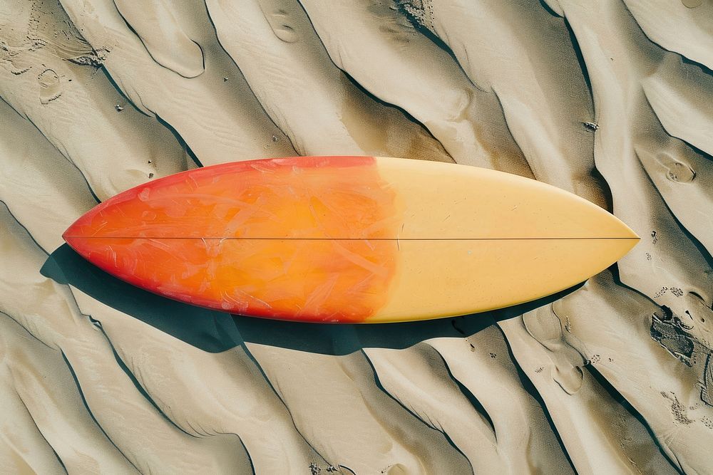 Colorful surfboard on sand outdoors nature recreation.