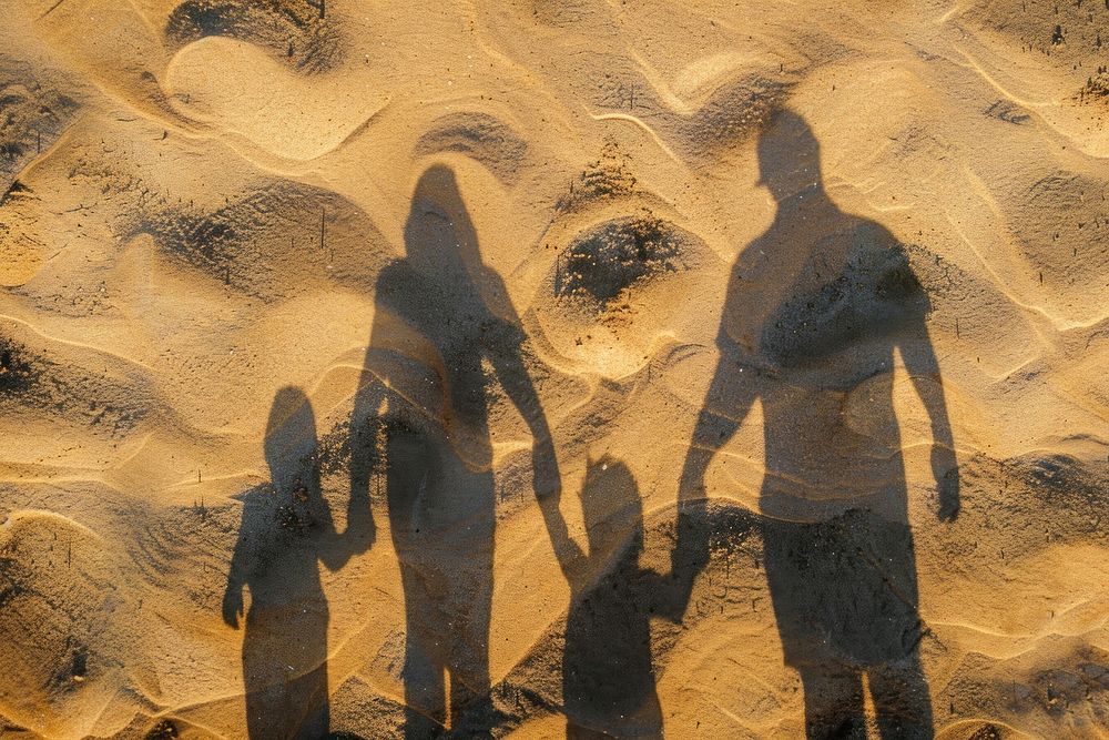 Family shadow on sand outdoors adult photo.