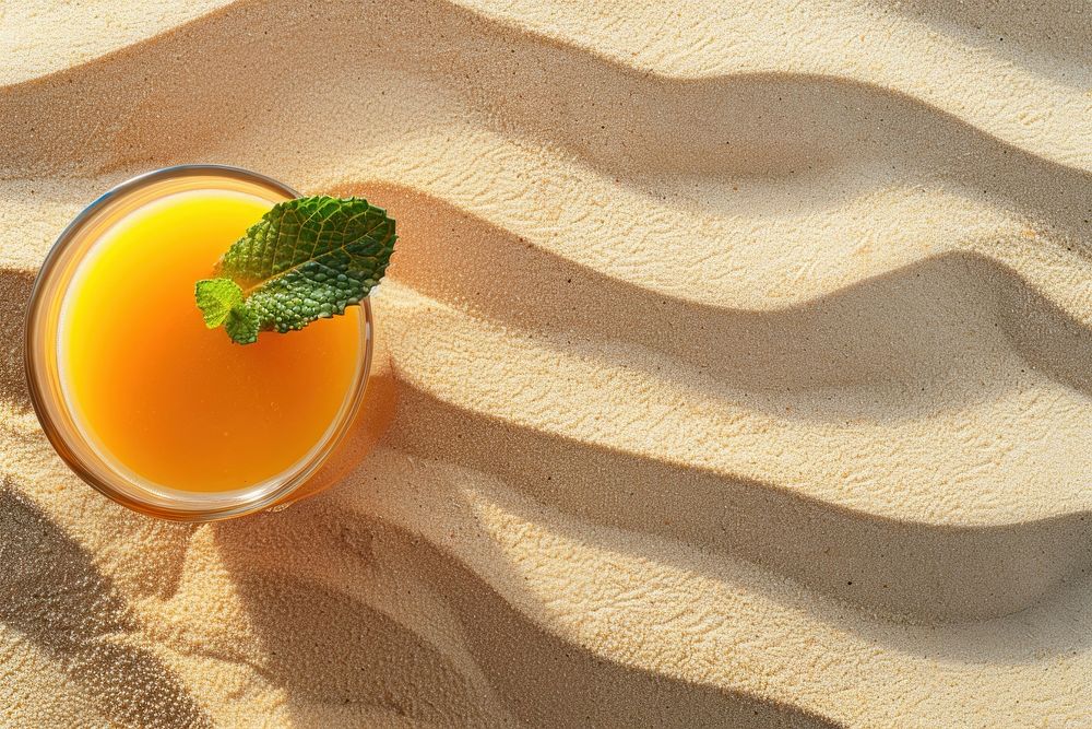 Fruit juice on sand cocktail outdoors plant.