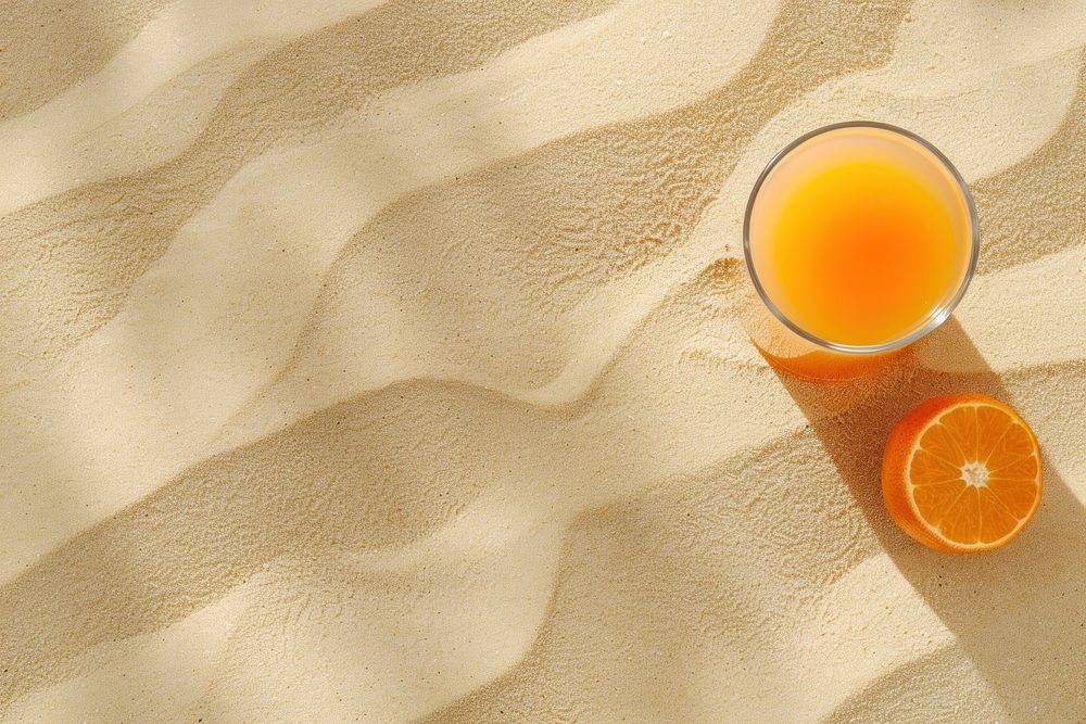 Fruit juice on sand backgrounds outdoors nature.