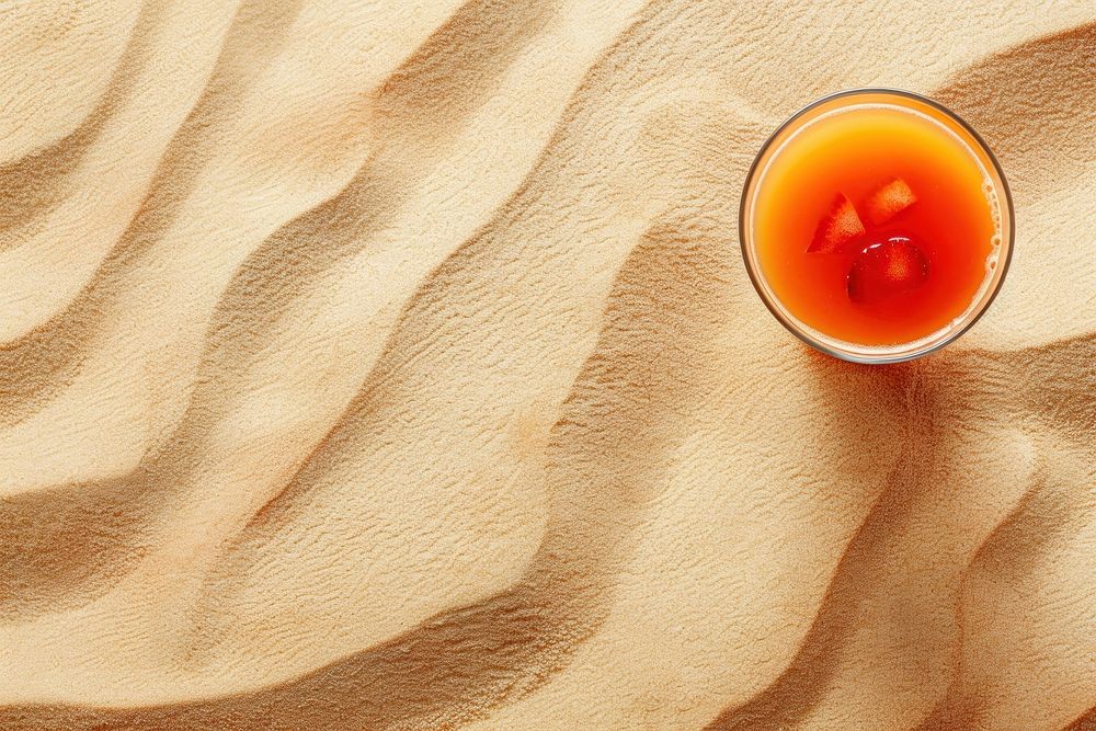 Fruit juice on sand backgrounds drink refreshment.