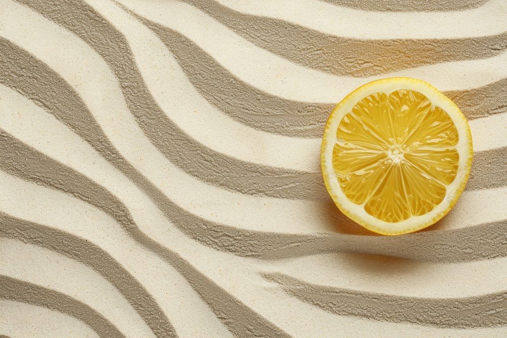 Lemon juice on sand backgrounds fruit food.