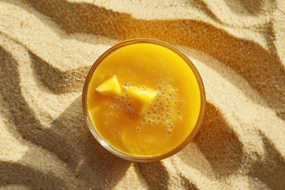 Mango juice on sand drink food refreshment.