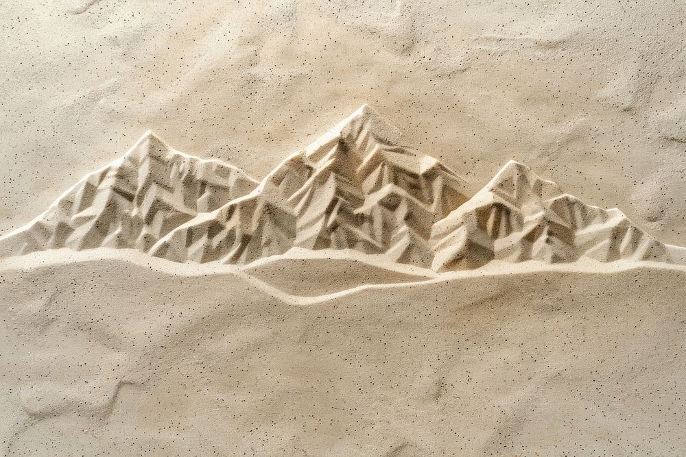 Mountain icon drawing on sand nature creativity landscape.