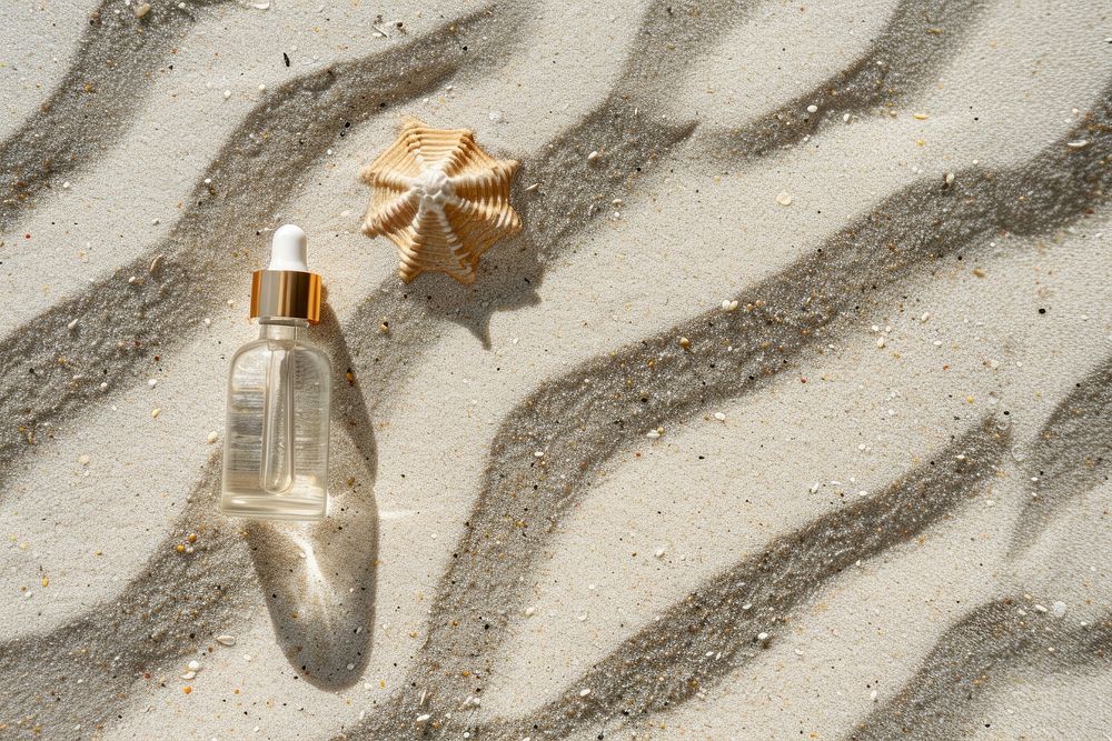 Serum on sand outdoors perfume nature.