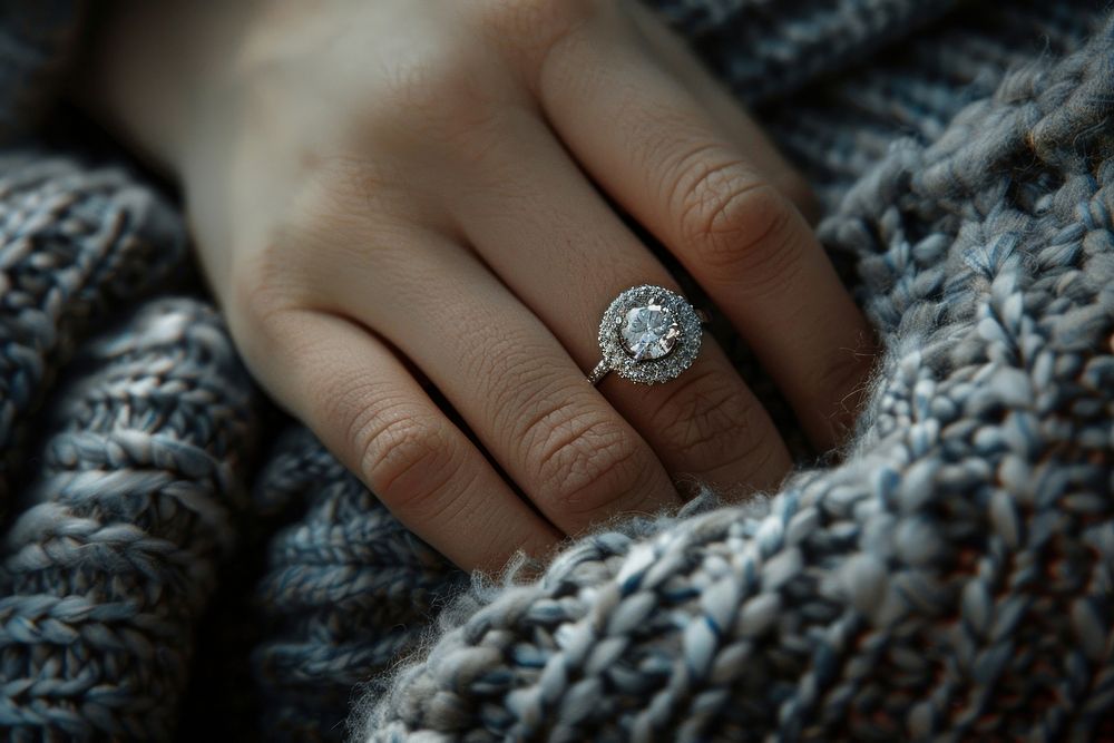 Diamond ring on woman finger jewelry winter accessories.
