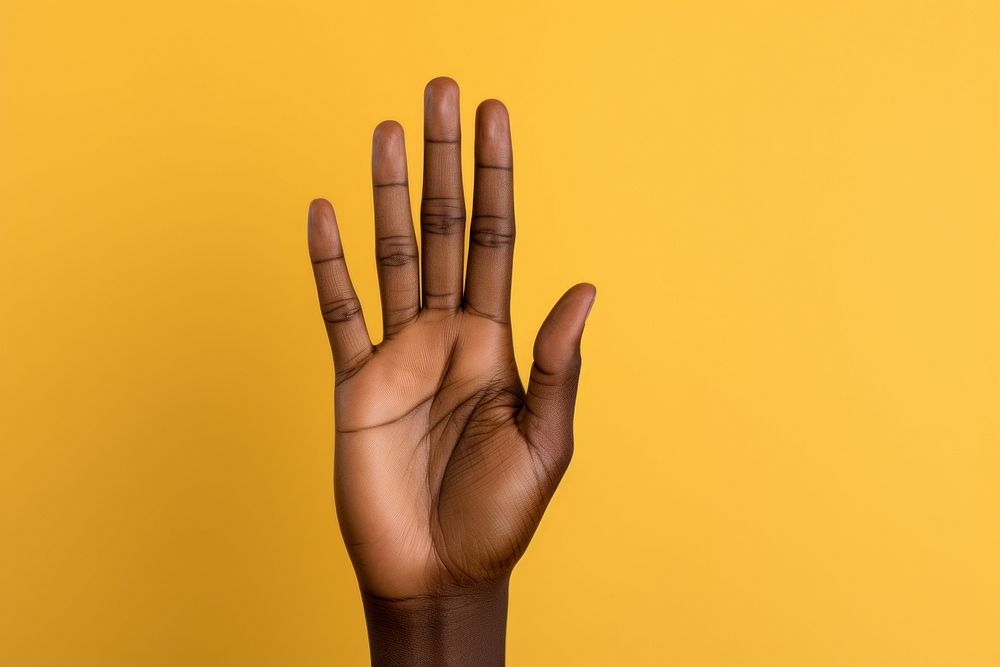 Black woman hand finger gesturing hand sign.