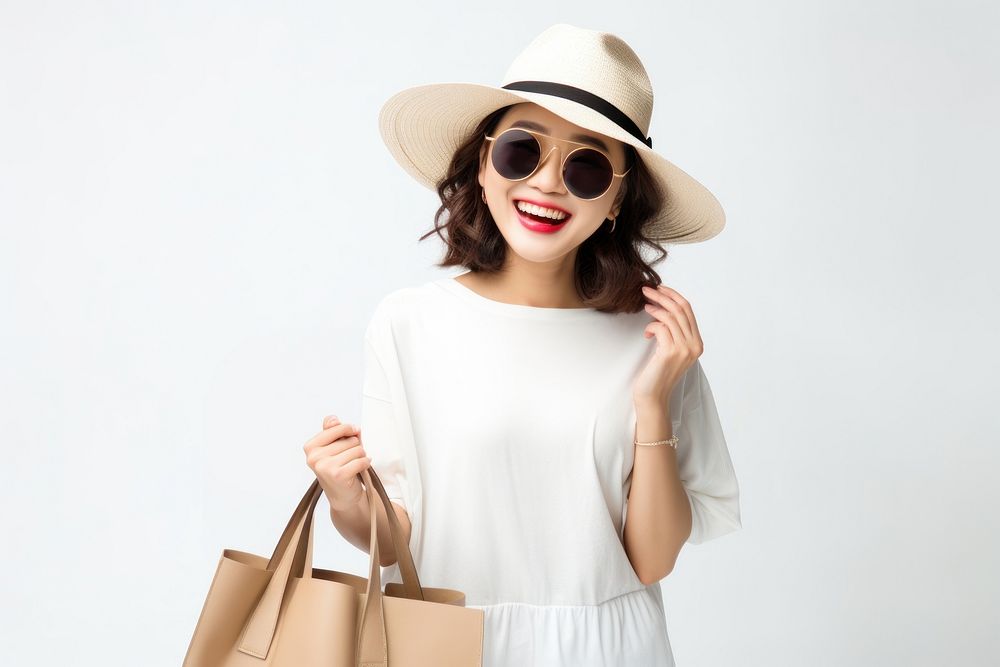 Asian woman holding shopping bag portrait glasses handbag.