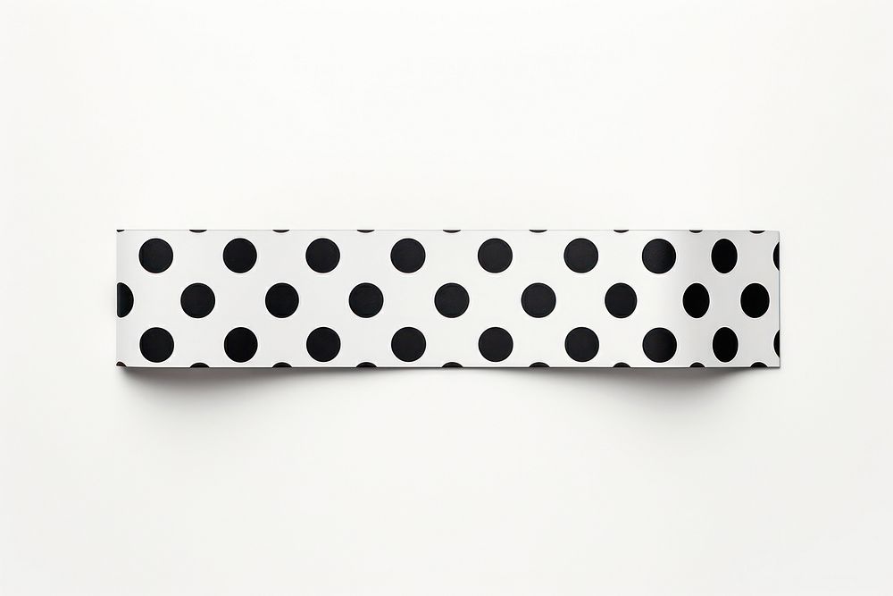 Black big dot pattern adhesive strip white white background rectangle.