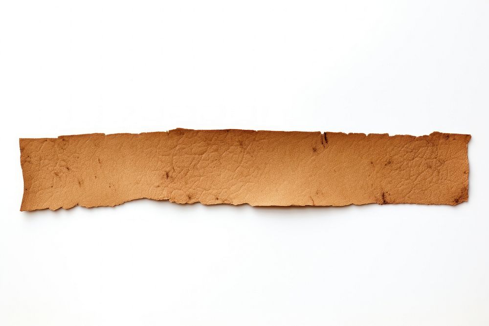 Earth tone adhesive strip rough white background weathered.