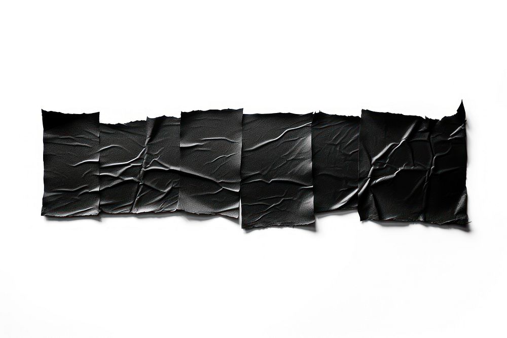 Glossy black vinyl adhesive strip paper white background monochrome.