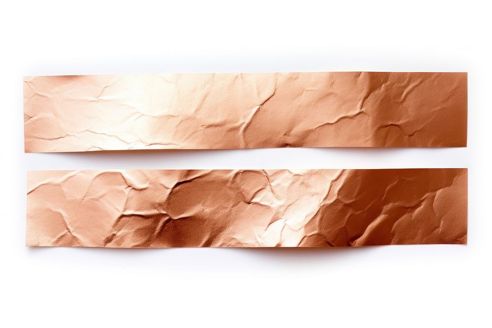Rose gold adhesive strip paper white background crumpled.
