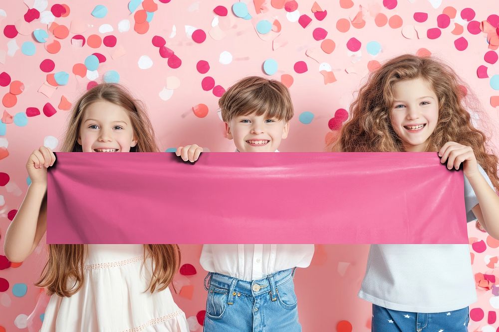 Happy kids holding pink sign