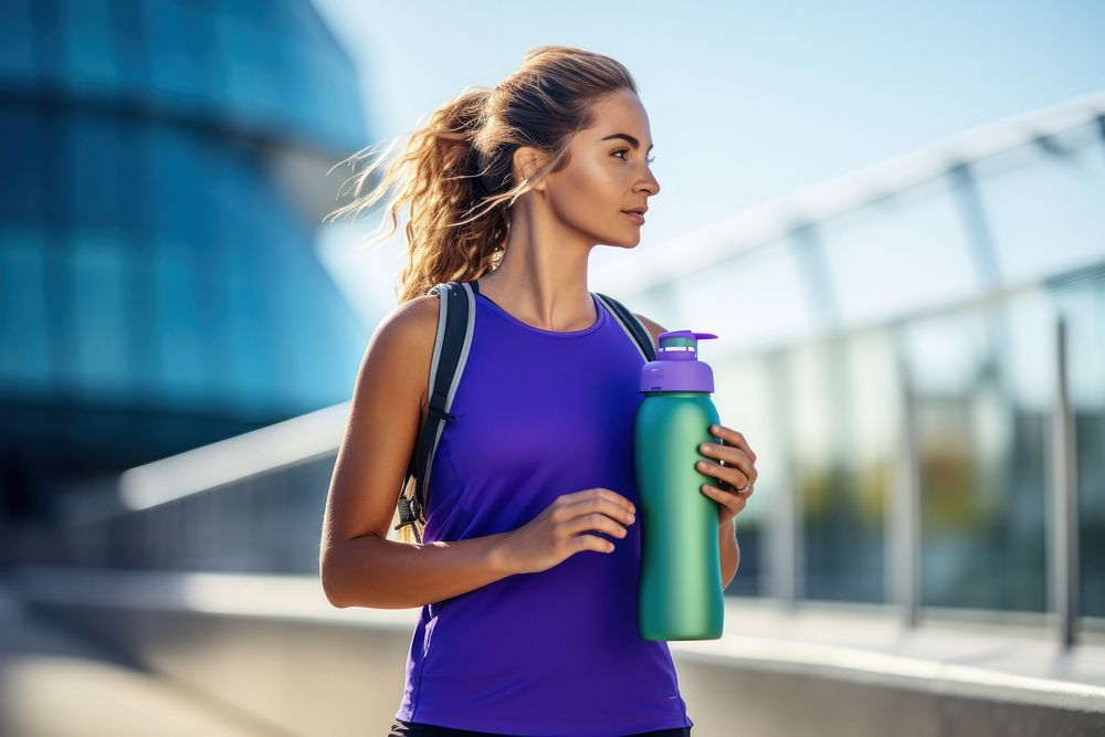Women holding water bottle jogging adult blue.